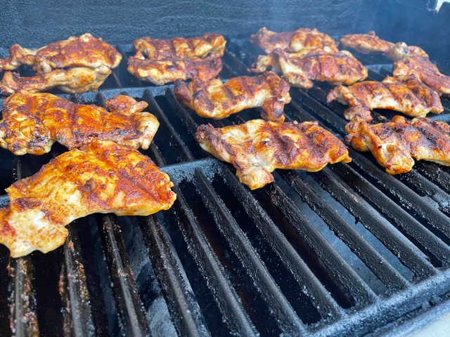 Meal prep chicken thighs on the grill close up